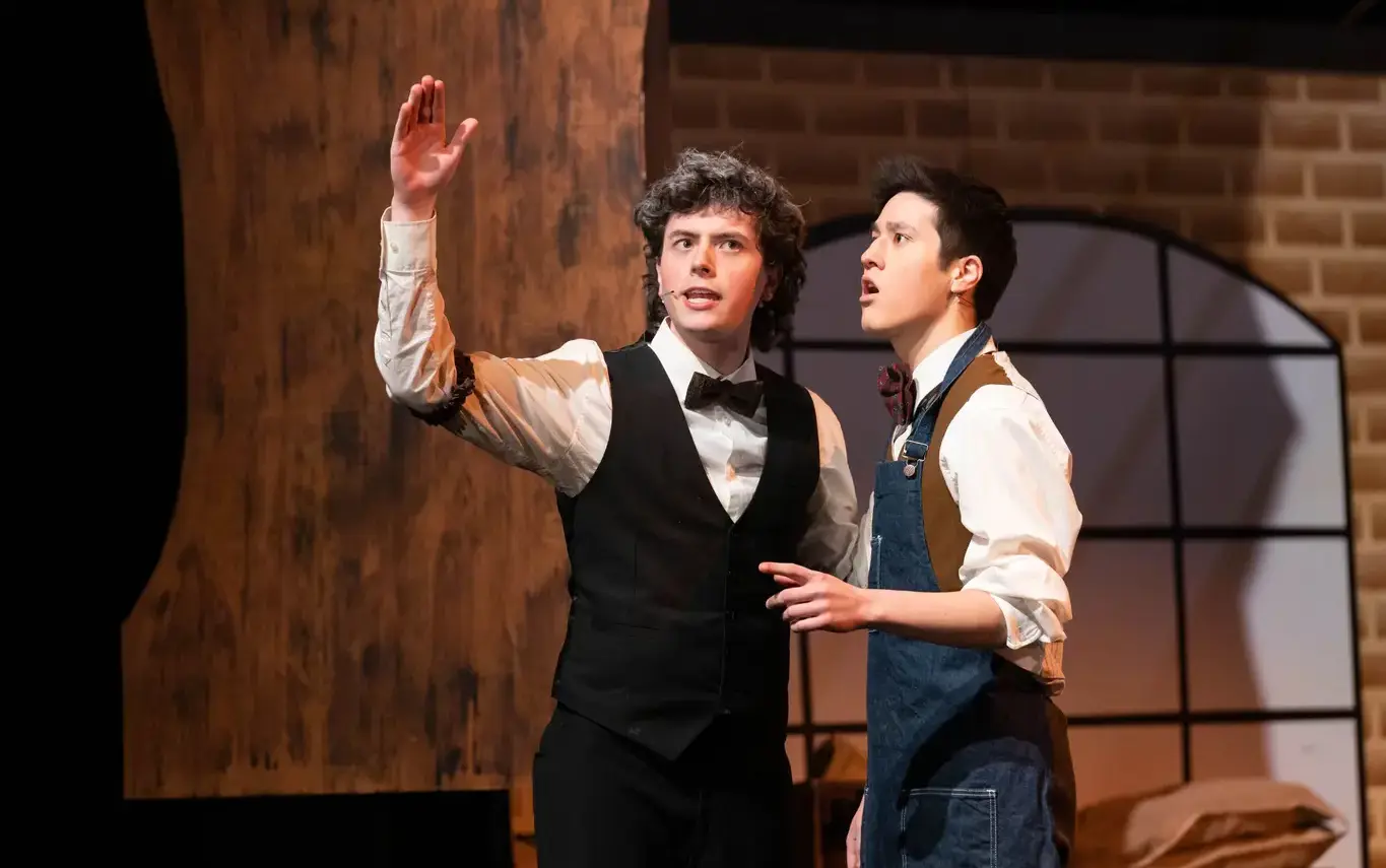 Loyola Academy students performing in the spring musical at the McGrath Family Performing Arts Center, showcasing talent, creativity, and school spirit.