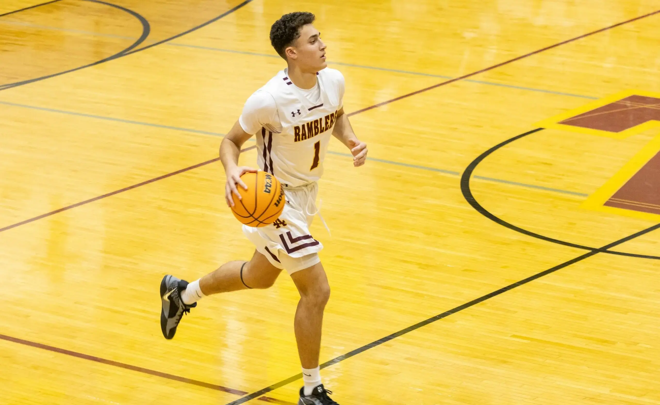 Student playing basketball