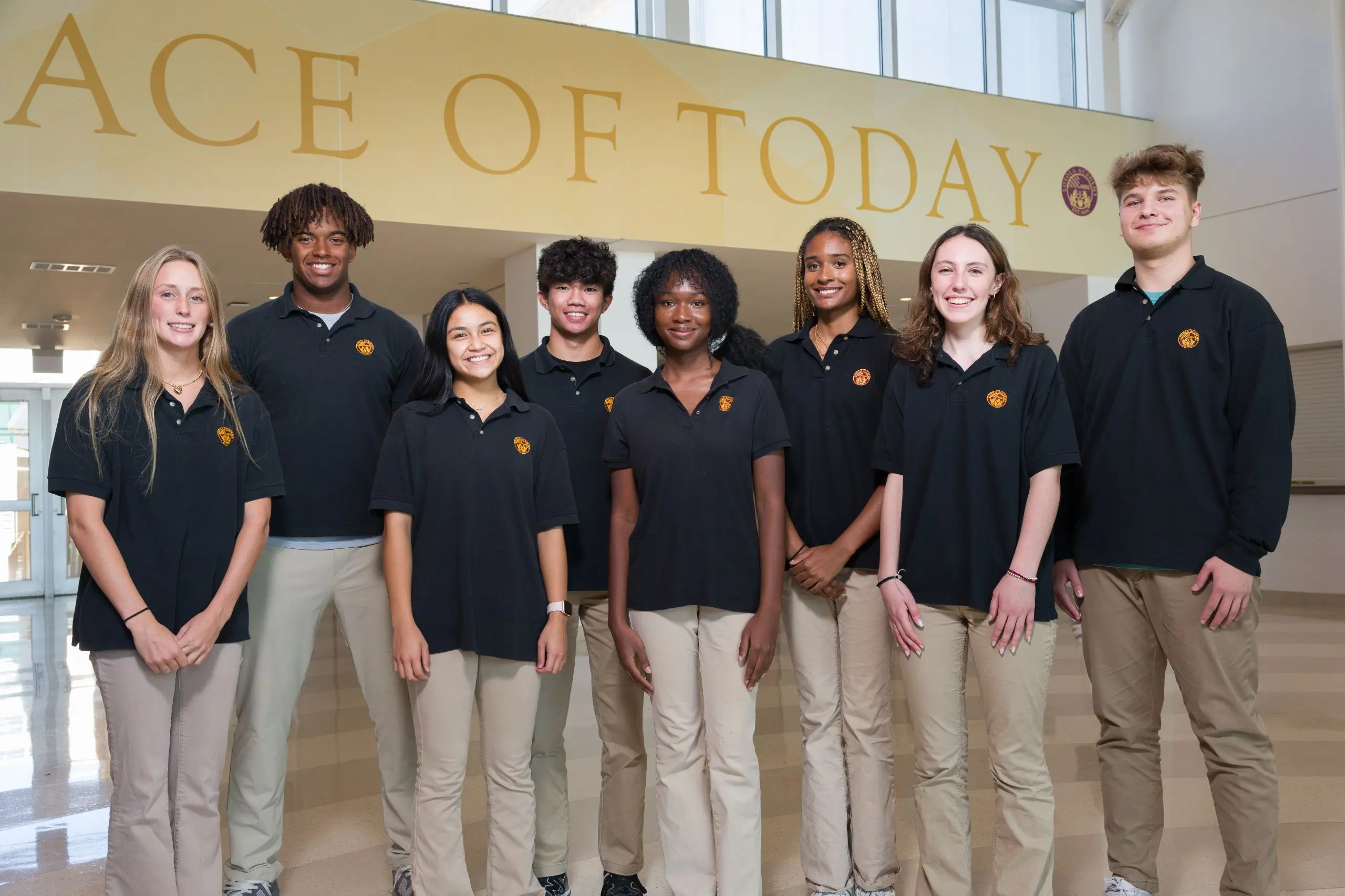 Loyola Academy students in the Pasquesi Piazza, smiling and representing the spirit of community, diversity, and leadership.