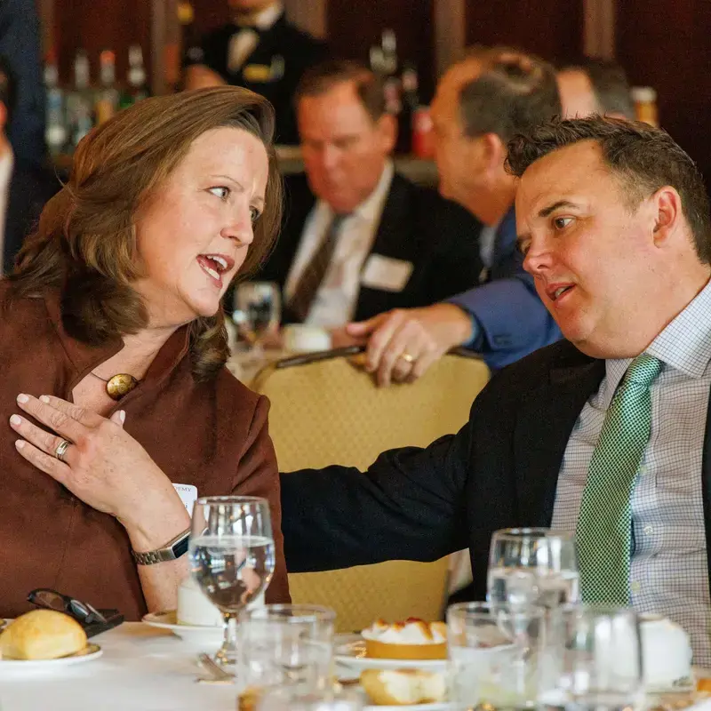 2 people networking at luncheon