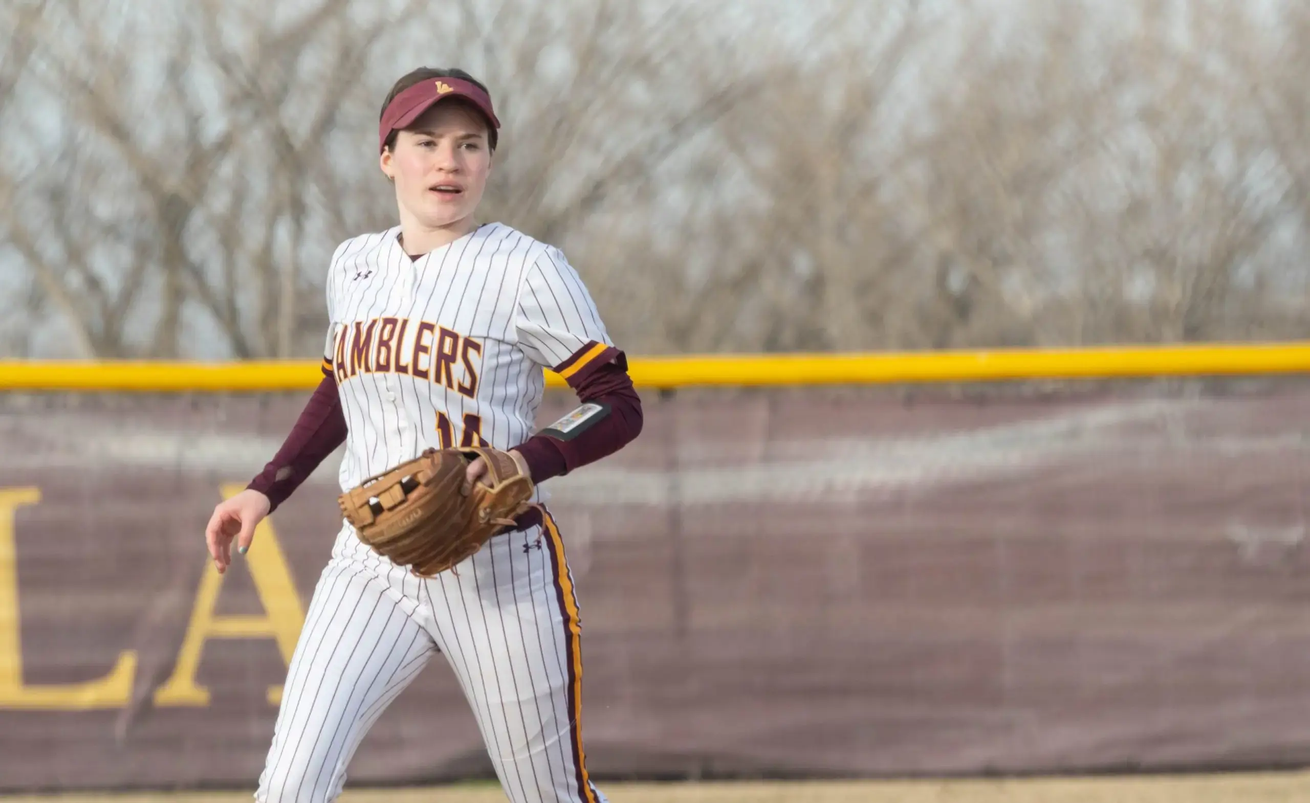 Student playing softball