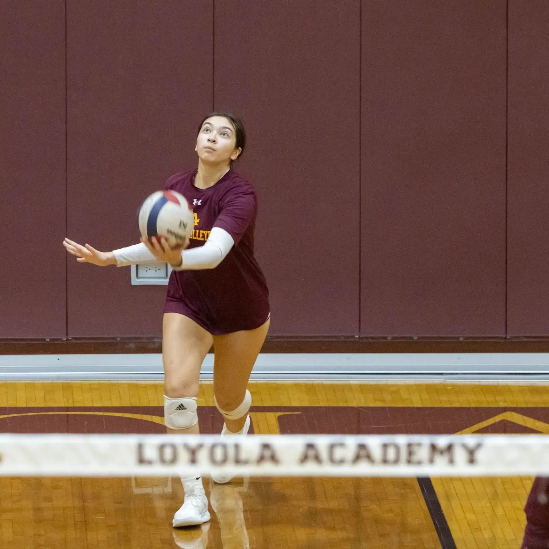 Athletes playing volleyball
